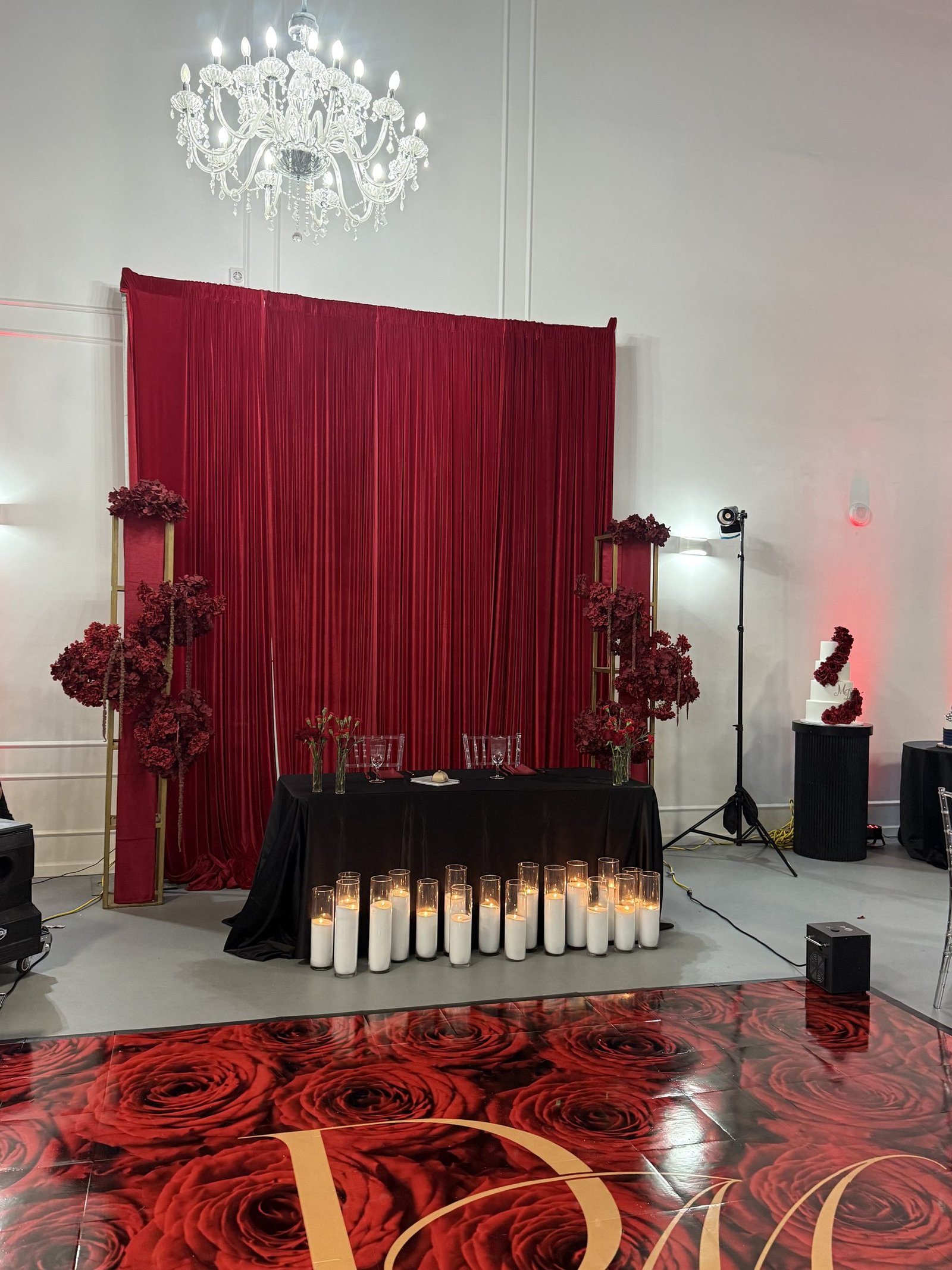Red carpet and rose wall entrance for a black-tie gala at The Hendrix event venue in Stafford, Houston