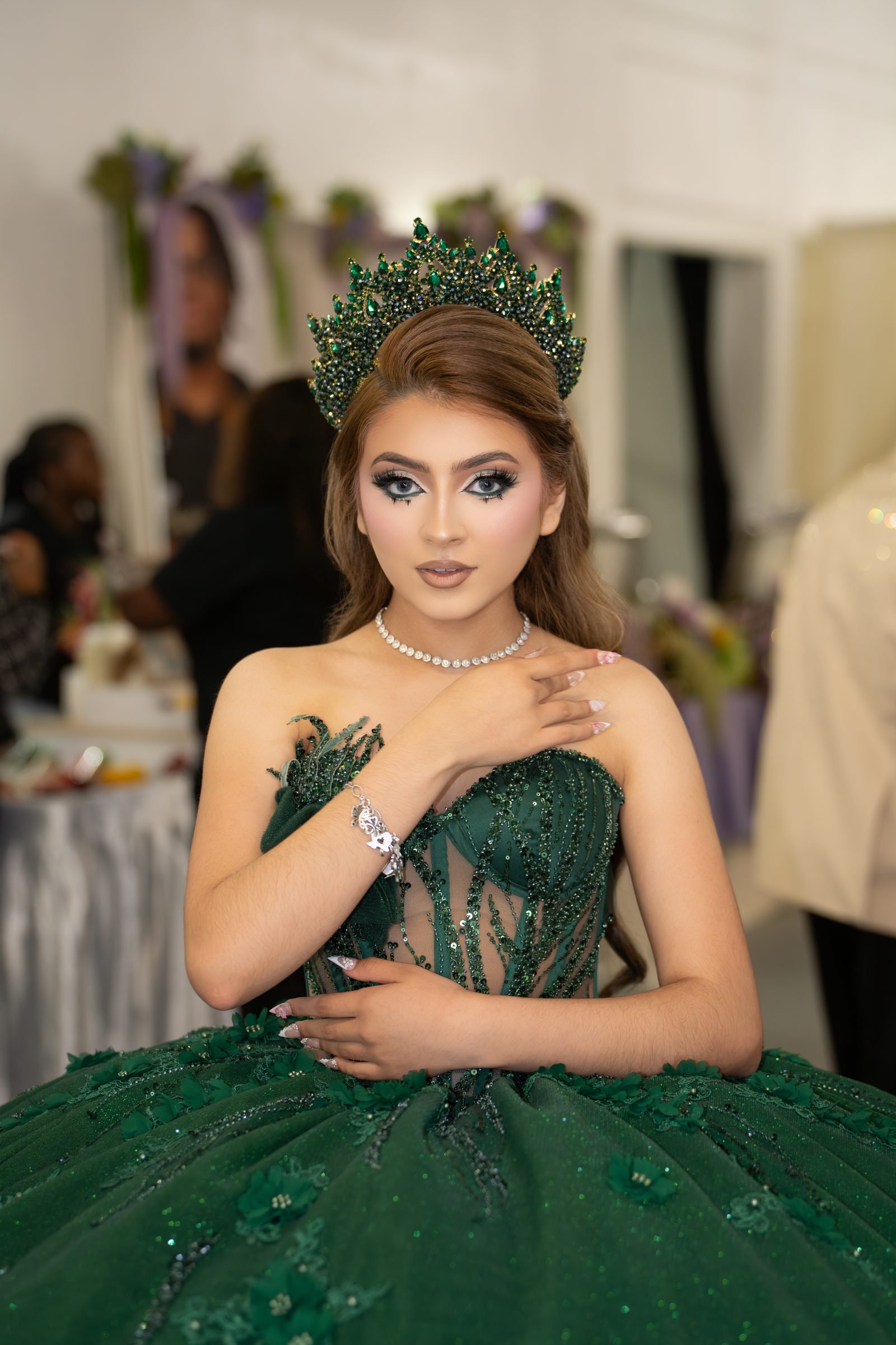 Quinceañera in an emerald ballgown and crown at The Hendrix in Stafford, Houston