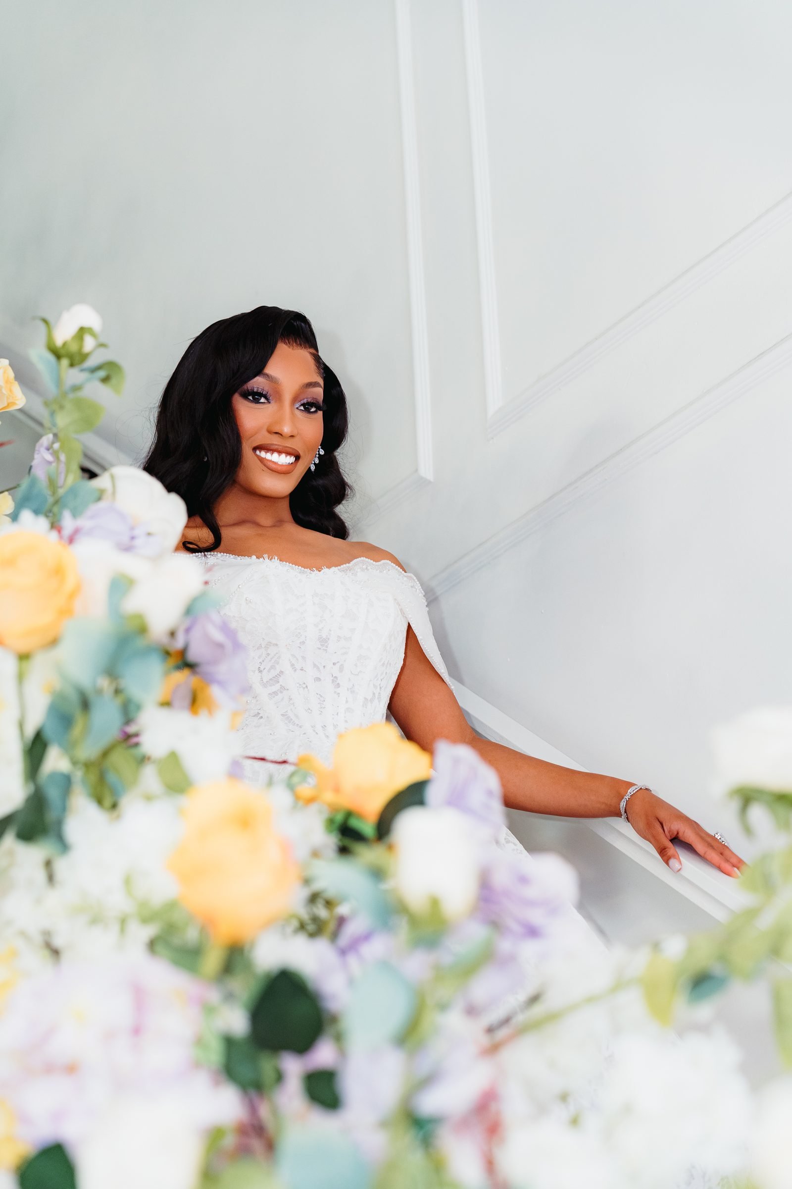 Bride surrounded by florals on her wedding day at The Hendrix event venue in Stafford, Texas, near Houston