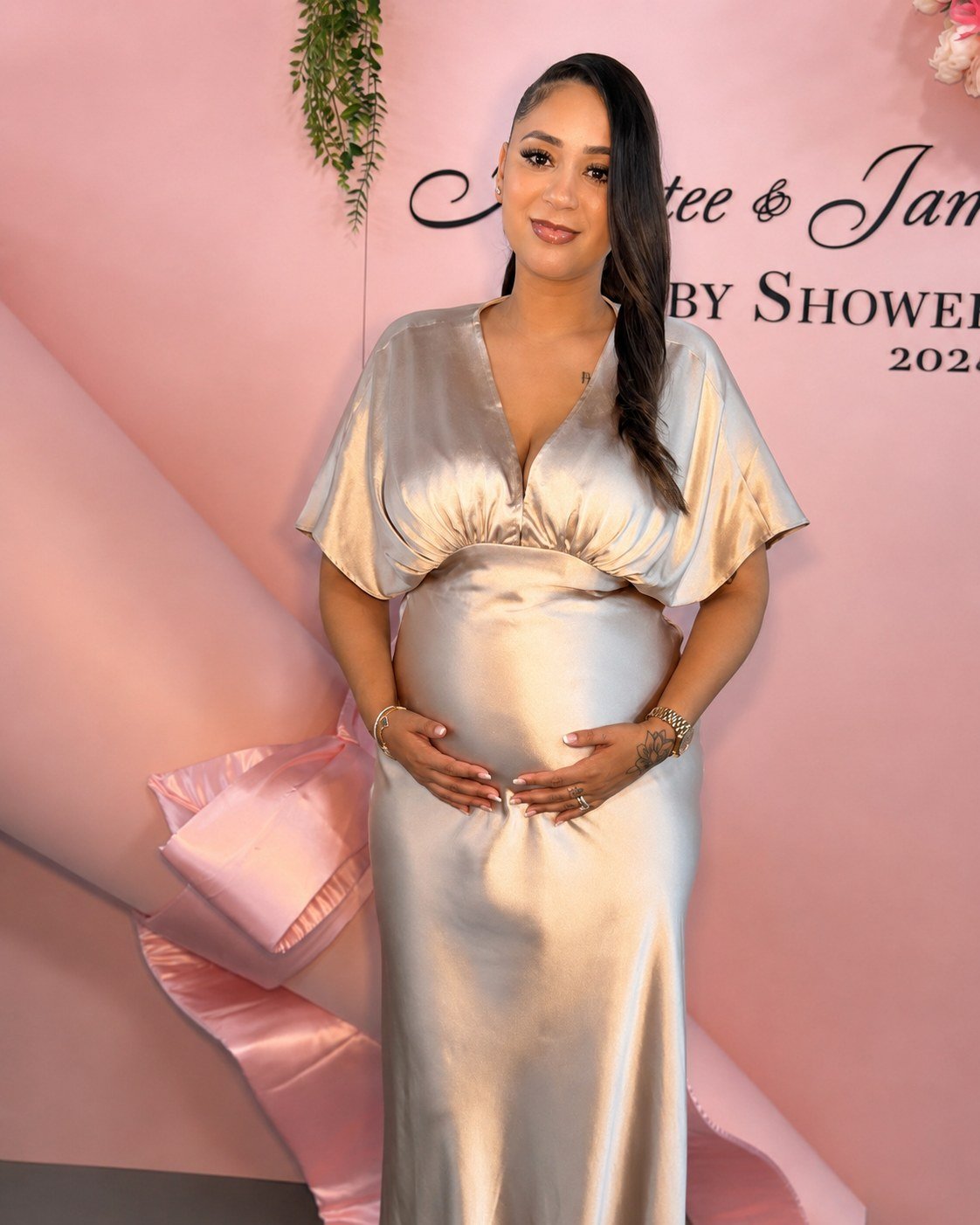 A mum-to-be in a champagne gown at her baby shower at The Hendrix, Stafford, Houston