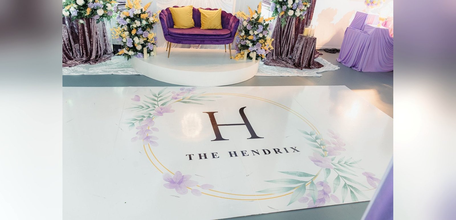 A monogrammed dance floor and lounge staging set for a celebration in The Mansion at The Hendrix, Stafford, Houston