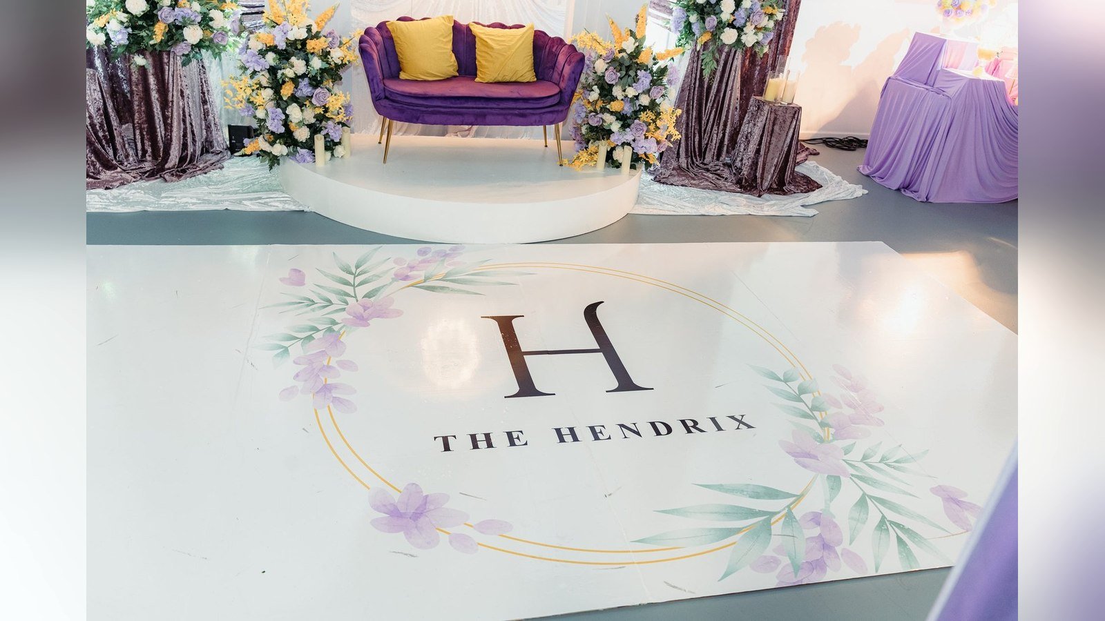 A monogrammed dance floor and lounge staging set for a celebration in The Mansion at The Hendrix, Stafford, Houston