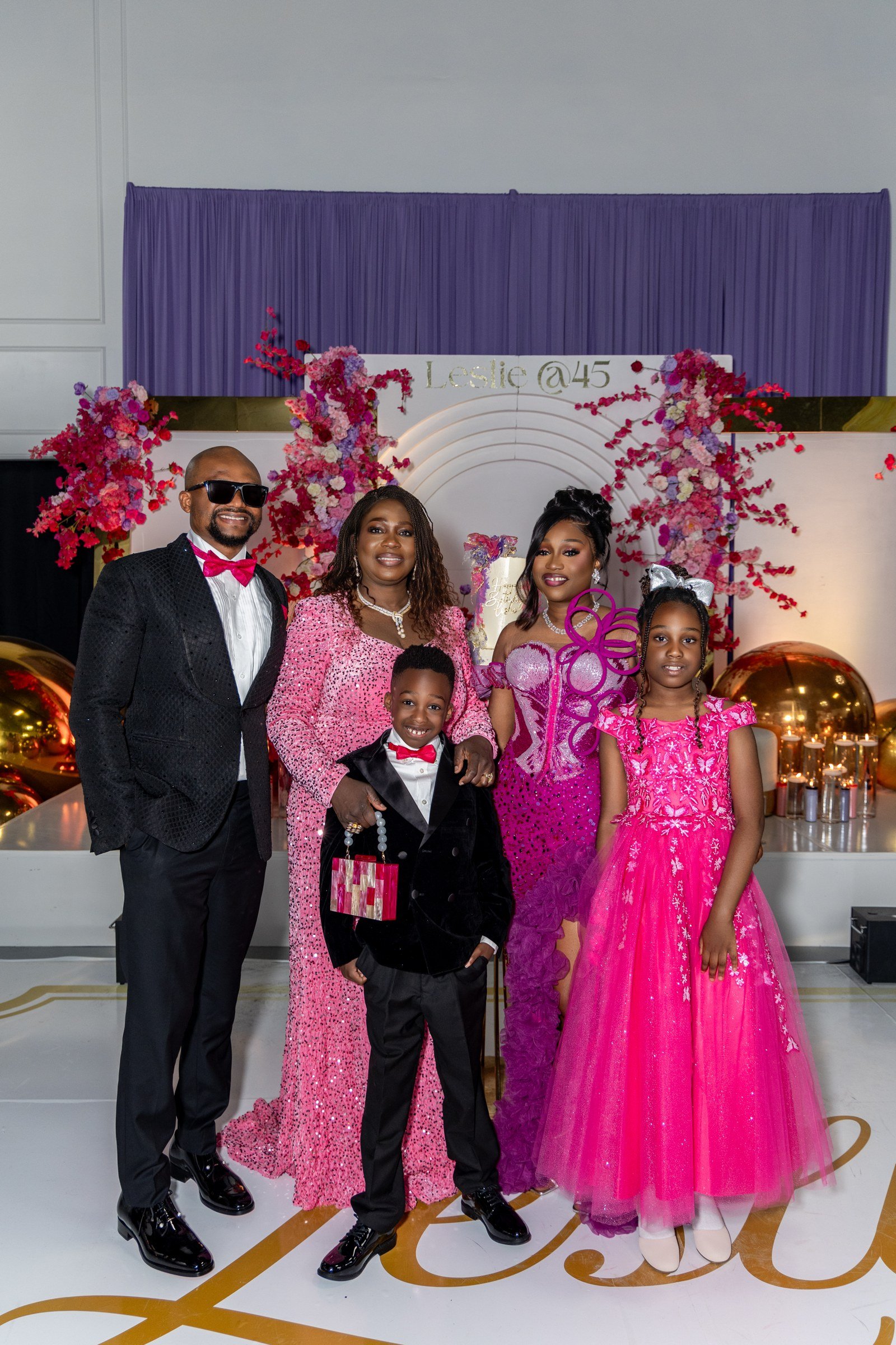 The celebrant and family beside the cake display at a Nigerian celebration at The Hendrix, Houston