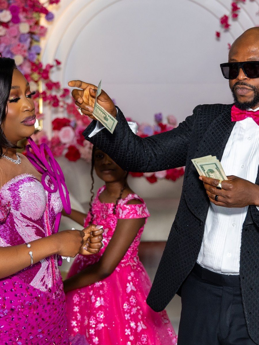 A guest spraying money on the celebrant at a Nigerian Owambe at The Hendrix, Stafford, Houston