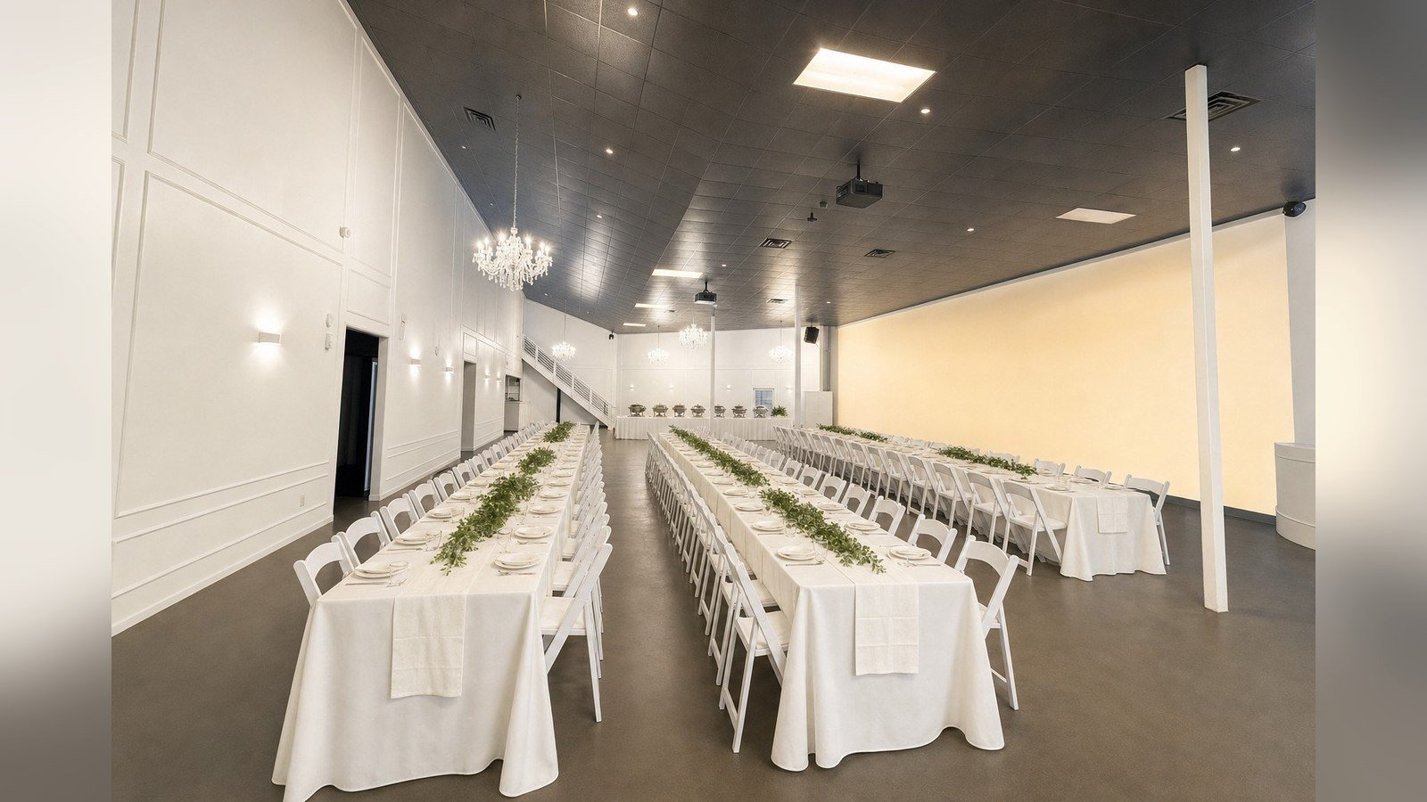 The Mansion at The Hendrix set with long banquet tables for a community gathering, Stafford, Texas