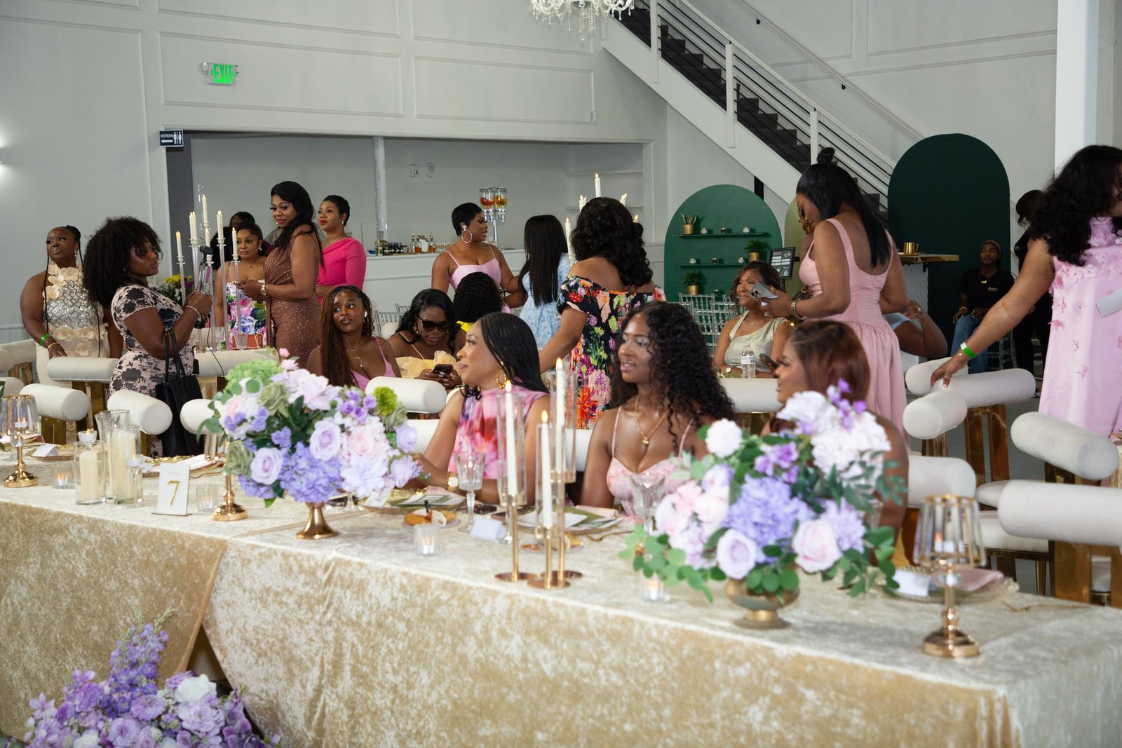A long banquet table in gold velvet with lavender and blush centrepieces at Dear Mama, The Hendrix