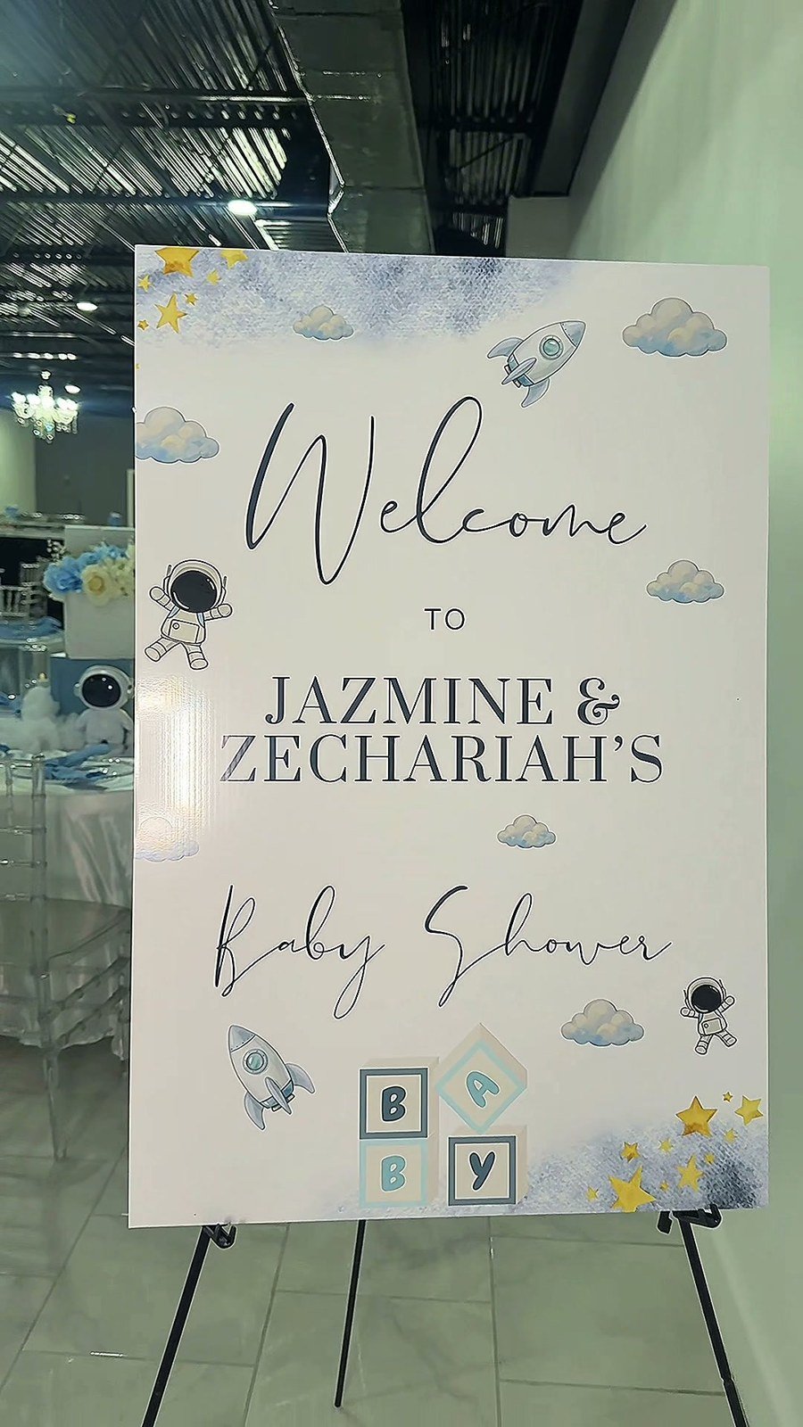 A welcome sign for Jazmine and Zechariah's space-themed baby shower at The Hendrix