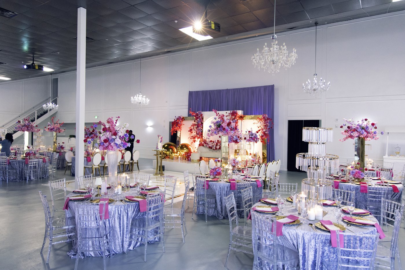 The Mansion at The Hendrix dressed with lilac velvet linens and crystal chandeliers