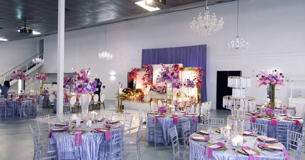 The Mansion at The Hendrix in Stafford dressed for a celebration with lilac linens, pink florals and crystal chandeliers, a short drive from Pearland